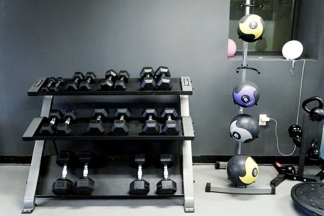 An area of our fitness center at the complex fitted with dumbells and weight balls